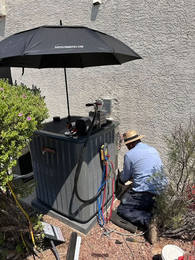HVAC technician performing outdoor AC maintenance in Miramar